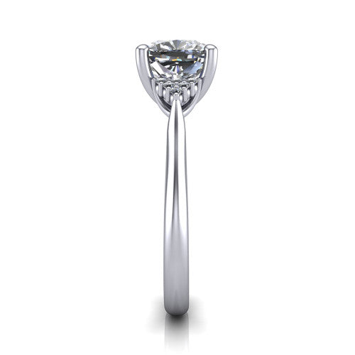Raya cushion three stone engagement ring in Platinum, side profile showing the slim milgrain cathedral band and the side clusters in profile