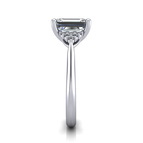 Raya emerald three stone engagement ring in Platinum, side profile showing the slim milgrain cathedral band and the side clusters in profile