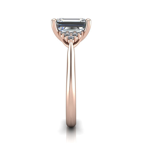 Raya emerald three stone engagement ring in 14K Rose Gold, side profile showing the slim milgrain cathedral band and the side clusters in profile