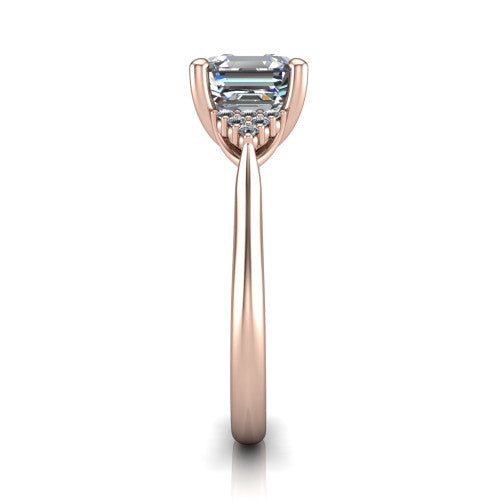 Raya square emerald three stone engagement ring in 18K Rose Gold, side profile showing the slim milgrain cathedral band and the side clusters in profile