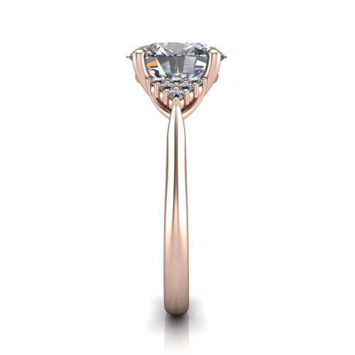 Raya oval three stone engagement ring in 14K Rose Gold, side profile showing the slim milgrain cathedral band and the side clusters in profile