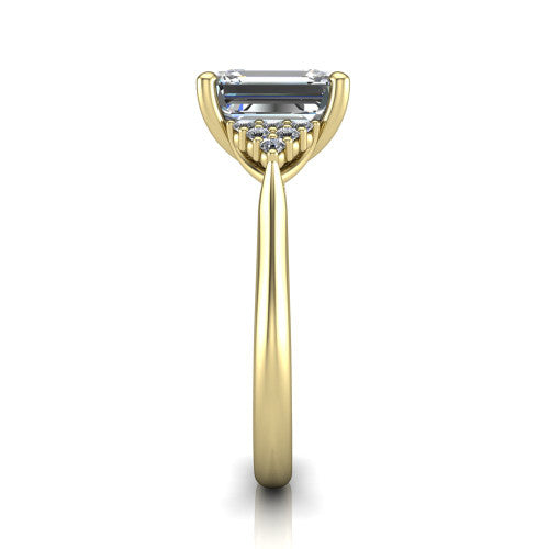 Raya emerald three stone engagement ring in 18K Yellow Gold, side profile showing the slim milgrain cathedral band and the side clusters in profile