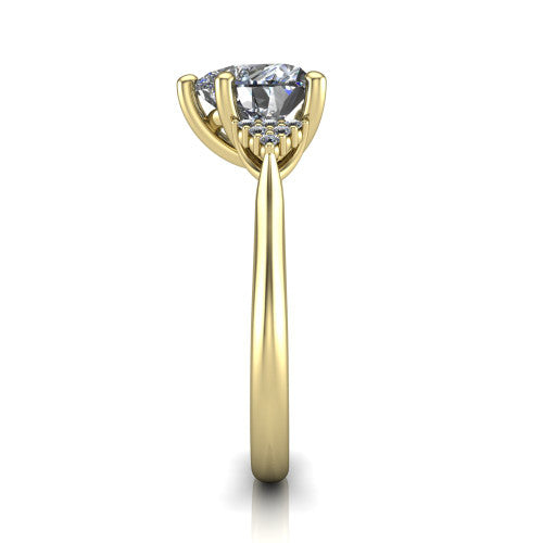 Raya heart three stone engagement ring in 14K Yellow Gold, side profile showing the slim milgrain cathedral band and the side clusters in profile