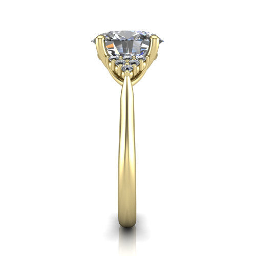 Raya oval three stone engagement ring in 18K Yellow Gold, side profile showing the slim milgrain cathedral band and the side clusters in profile