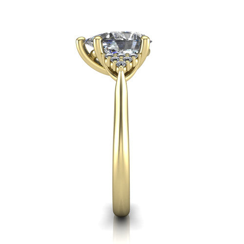 Raya pear three stone engagement ring in 18K Yellow Gold, side profile showing the slim milgrain cathedral band and the side clusters in profile