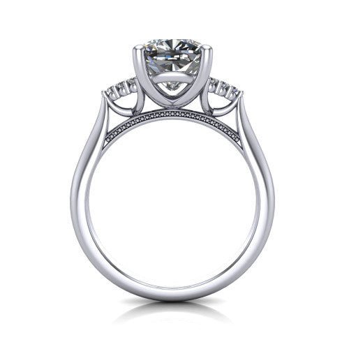 Raya cushion three stone engagement ring in 18K White Gold, through-finger front profile showing the four-prong center raised above the cathedral band with cluster shoulders