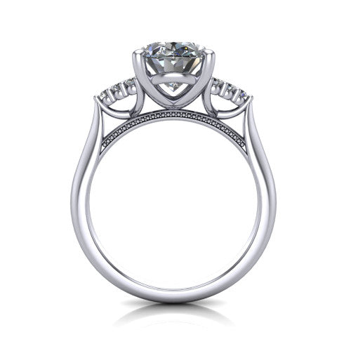 Raya oval three stone engagement ring in Platinum, through-finger front profile showing the four-prong center raised above the cathedral band with cluster shoulders