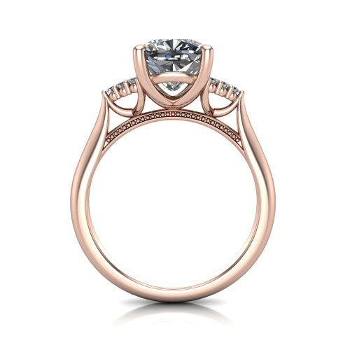 Raya cushion three stone engagement ring in 14K Rose Gold, through-finger front profile showing the four-prong center raised above the cathedral band with cluster shoulders
