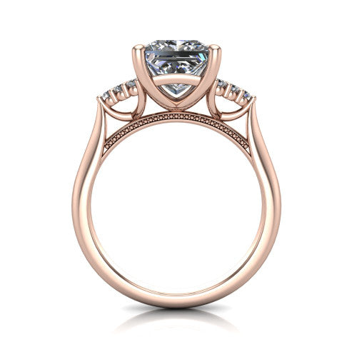 Raya princess three stone engagement ring in 18K Rose Gold, through-finger front profile showing the four-prong center raised above the cathedral band with cluster shoulders