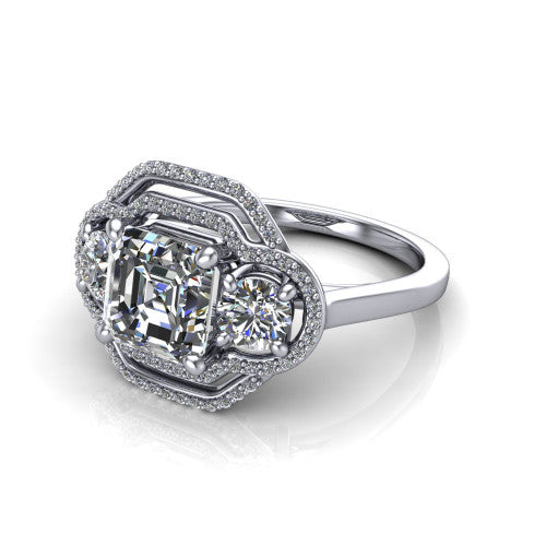 Elle square emerald three stone halo engagement ring in 14K White Gold, three-quarter perspective showing the center stone flanked by two side stones in an interlocking double pav&eacute; halo above a tapered band