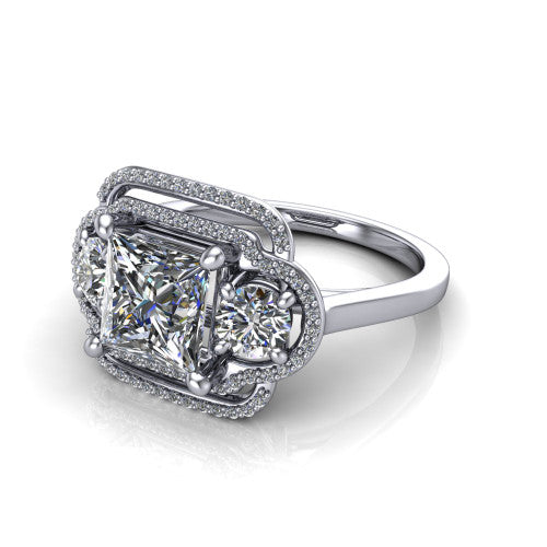 Elle princess three stone halo engagement ring in 14K White Gold, three-quarter perspective showing the center stone flanked by two side stones in an interlocking double pav&eacute; halo above a tapered band