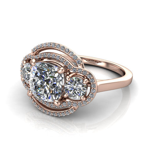 Elle cushion three stone halo engagement ring in 14K Rose Gold, three-quarter perspective showing the center stone flanked by two side stones in an interlocking double pav&eacute; halo above a tapered band