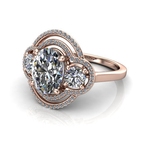 Elle oval three stone halo engagement ring in 18K Rose Gold, three-quarter perspective showing the center stone flanked by two side stones in an interlocking double pav&eacute; halo above a tapered band