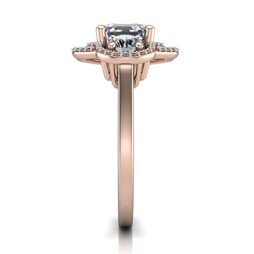 Elle square emerald three stone halo engagement ring in 18K Rose Gold, side profile showing the open undergallery and the pav&eacute; halo scrollwork in profile