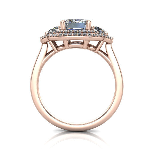 Elle emerald three stone halo engagement ring in 18K Rose Gold, through-finger front profile showing the haloed three-stone head raised above the cathedral shoulders