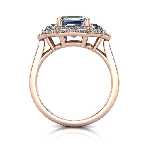 Elle square emerald three stone halo engagement ring in 14K Rose Gold, through-finger front profile showing the haloed three-stone head raised above the cathedral shoulders