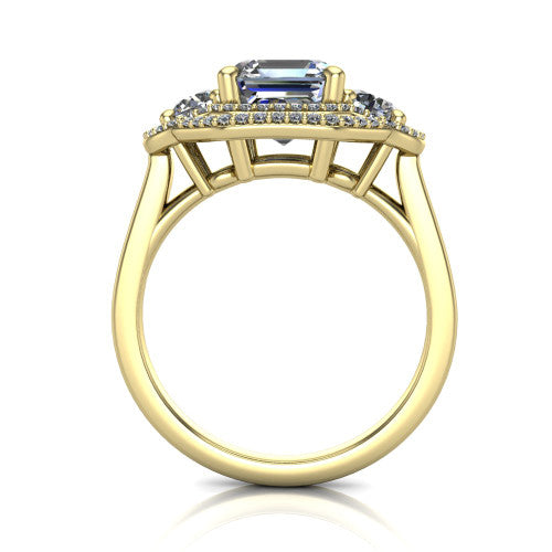Elle square emerald three stone halo engagement ring in 14K Yellow Gold, through-finger front profile showing the haloed three-stone head raised above the cathedral shoulders