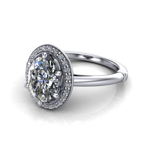 Journey oval halo engagement ring in Platinum, three-quarter perspective showing the haloed center raised above a plain polished band