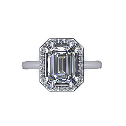 Journey emerald halo engagement ring in Platinum, top-down view showing the center framed by a pav&eacute; halo with compass prongs