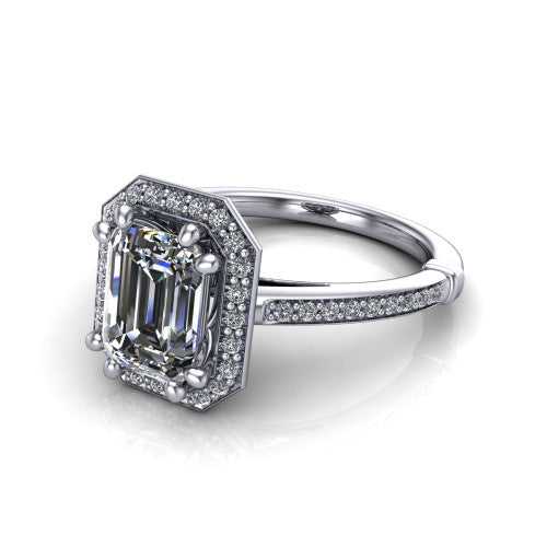 Alessandra emerald halo engagement ring in Platinum, three-quarter perspective showing the haloed center raised above a slim pav&eacute; band