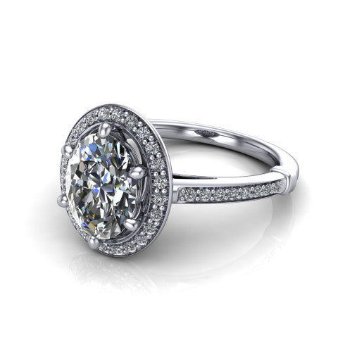 Alessandra oval halo engagement ring in Platinum, three-quarter perspective showing the haloed center raised above a slim pav&eacute; band