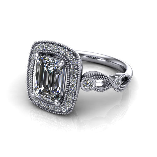 Lana emerald halo engagement ring in Platinum, three-quarter perspective showing the center in a milgrain cushion halo above a vintage leaf-motif band