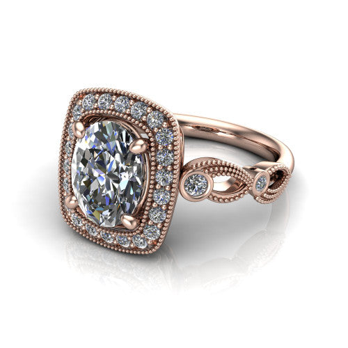 Lana oval halo engagement ring in 18K Rose Gold, three-quarter perspective showing the center in a milgrain cushion halo above a vintage leaf-motif band
