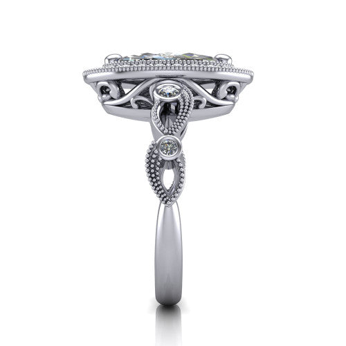 Lana marquise halo engagement ring in Platinum, side profile showing the open filigree undergallery and the bezel-set accent on the vintage leaf band