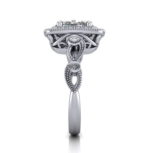 Lana oval halo engagement ring in Platinum, side profile showing the open filigree undergallery and the bezel-set accent on the vintage leaf band