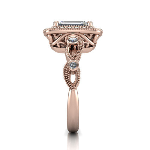 Lana emerald halo engagement ring in 14K Rose Gold, side profile showing the open filigree undergallery and the bezel-set accent on the vintage leaf band