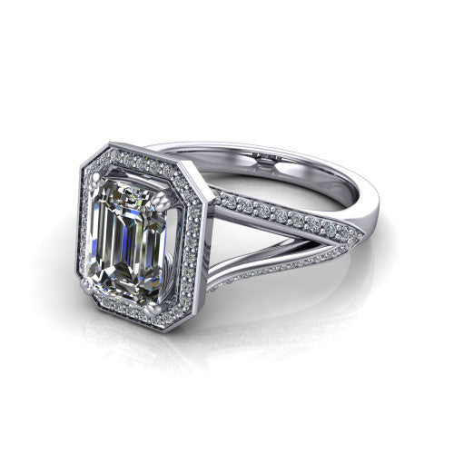 Antonella emerald halo engagement ring in Platinum, three-quarter perspective showing the haloed center raised above a split pav&eacute; shank