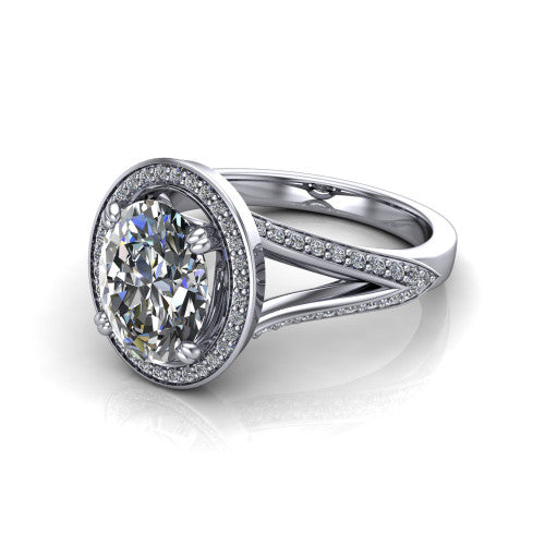 Antonella oval halo engagement ring in Platinum, three-quarter perspective showing the haloed center raised above a split pav&eacute; shank