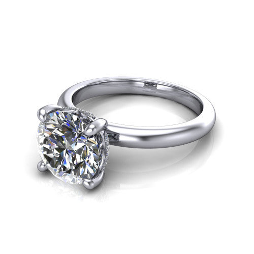 Ariel round classic engagement ring in 14K White Gold, three-quarter perspective showing the solitaire center diamond raised in four prongs above a slim polished band