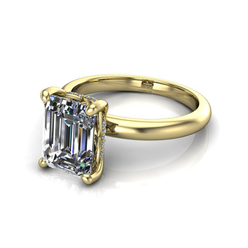 Ariel emerald classic engagement ring in 18K Yellow Gold, three-quarter perspective showing the solitaire center diamond raised in four prongs above a slim polished band