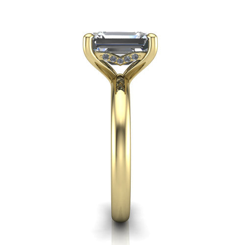 Ariel emerald classic engagement ring in 18K Yellow Gold, side profile showing the hidden halo under the head and the slim polished band