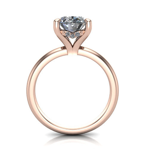 Ariel oval classic engagement ring in 18K Rose Gold, through-finger front profile showing the hidden halo of accent diamonds tucked beneath the center basket