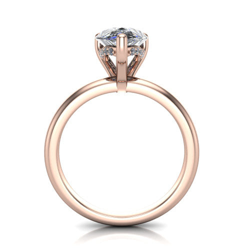 Ariel pear classic engagement ring in 18K Rose Gold, through-finger front profile showing the hidden halo of accent diamonds tucked beneath the center basket