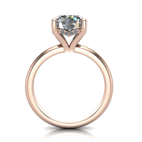 Ariel round classic engagement ring in 18K Rose Gold, through-finger front profile showing the hidden halo of accent diamonds tucked beneath the center basket