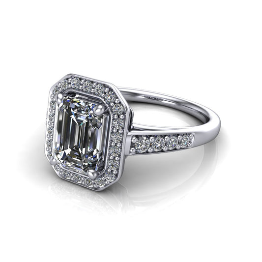 Leia emerald halo engagement ring in 18K White Gold, three-quarter perspective showing the step-cut emerald center diamond, pavé diamond halo, and pavé-set shank