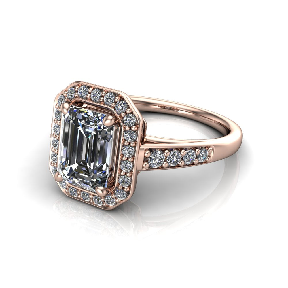 Leia emerald halo engagement ring in 18K Rose Gold, three-quarter perspective showing the step-cut emerald center diamond, pavé diamond halo, and pavé-set shank