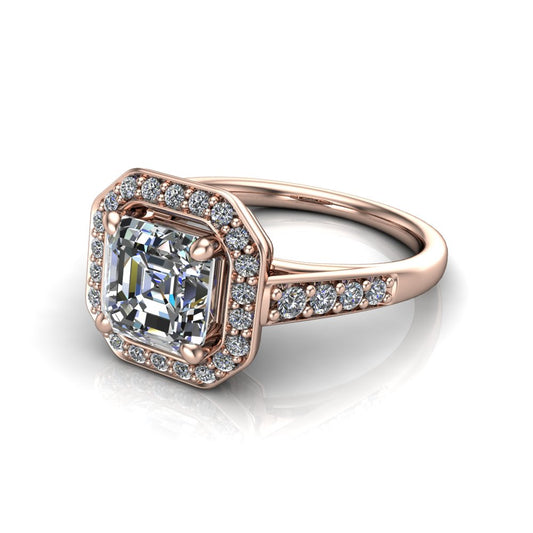 Leia square emerald halo engagement ring in 18K Rose Gold, three-quarter perspective showing the step-cut square emerald center diamond, pavé diamond halo, and pavé-set shank