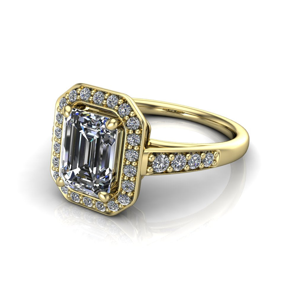 Leia emerald halo engagement ring in 18K Yellow Gold, three-quarter perspective showing the step-cut emerald center diamond, pavé diamond halo, and pavé-set shank