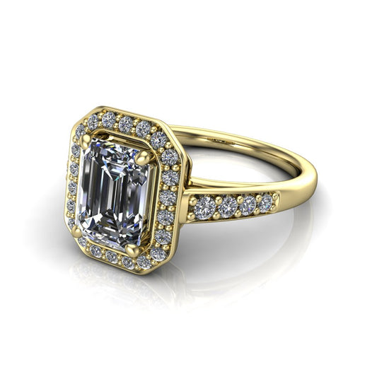 Leia emerald halo engagement ring in 18K Yellow Gold, three-quarter perspective showing the step-cut emerald center diamond, pavé diamond halo, and pavé-set shank