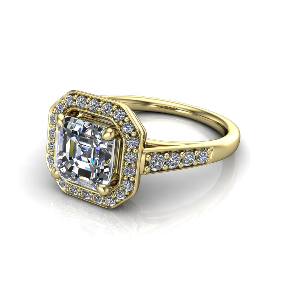 Leia square emerald halo engagement ring in 18K Yellow Gold, three-quarter perspective showing the step-cut square emerald center diamond, pavé diamond halo, and pavé-set shank