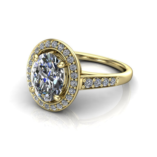 Leia oval halo engagement ring in 18K Yellow Gold, three-quarter perspective showing the brilliant oval-cut center diamond, pavé diamond halo, and pavé-set shank