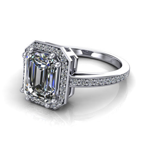 Skye emerald halo engagement ring in Platinum, three-quarter perspective showing the haloed center raised above a pav&eacute; shank and pav&eacute;-lined basket