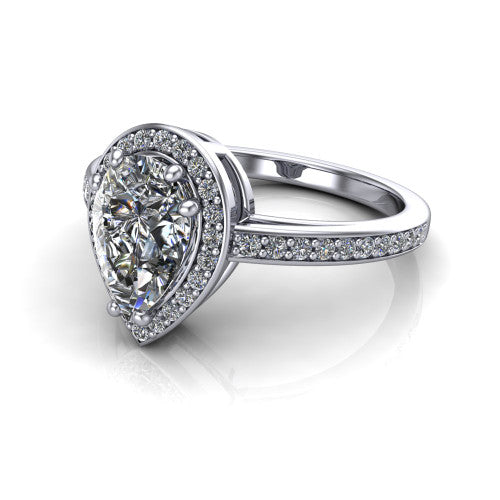 Skye pear halo engagement ring in 18K White Gold, three-quarter perspective showing the haloed center raised above a pav&eacute; shank and pav&eacute;-lined basket