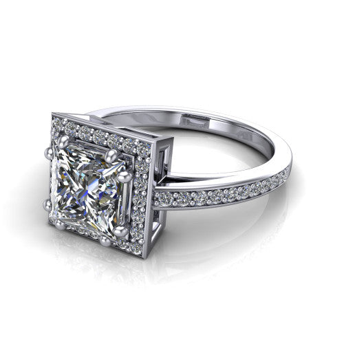 Skye princess halo engagement ring in Platinum, three-quarter perspective showing the haloed center raised above a pav&eacute; shank and pav&eacute;-lined basket