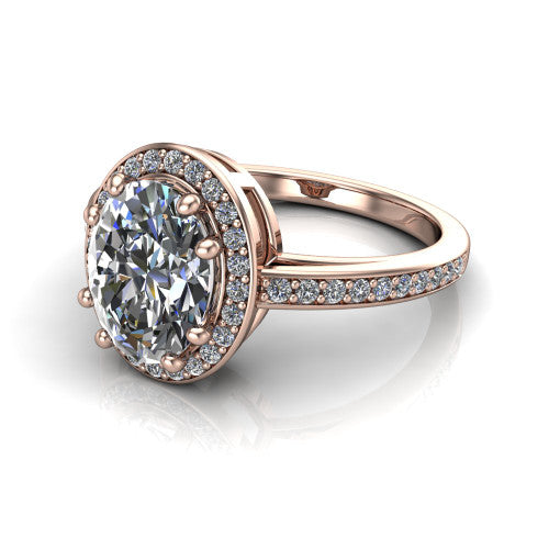 Skye oval halo engagement ring in 18K Rose Gold, three-quarter perspective showing the haloed center raised above a pav&eacute; shank and pav&eacute;-lined basket