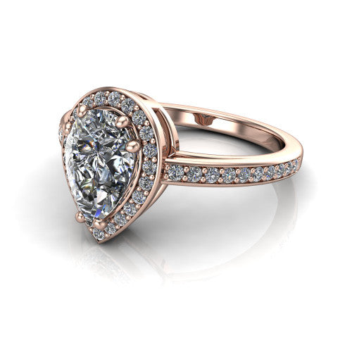 Skye pear halo engagement ring in 18K Rose Gold, three-quarter perspective showing the haloed center raised above a pav&eacute; shank and pav&eacute;-lined basket